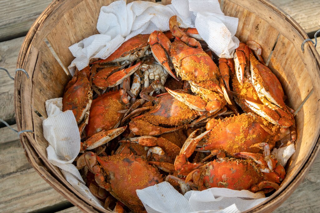 Wooden basket full of steamed blue crabs